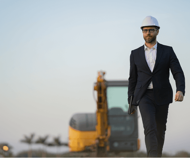 Professional in hard hat walking confidently